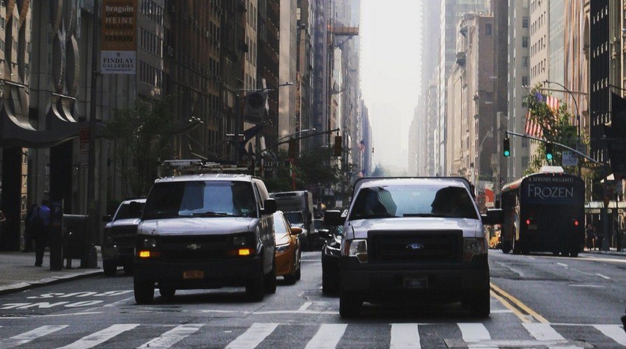 Yellow cabs and traffic on a Manhattan avenue