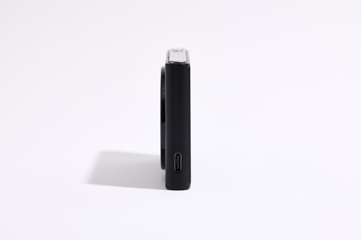 PiX Pocket Camera in Black, side view with USB-C port