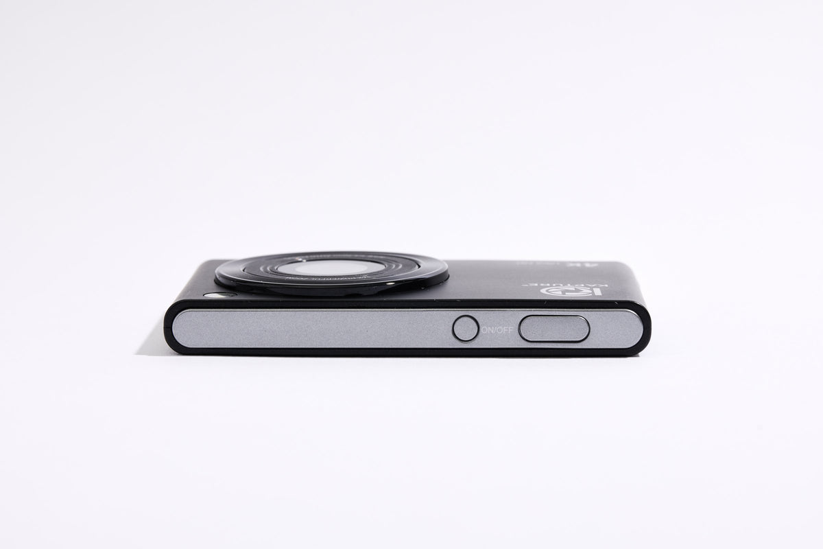 PiX Pocket Camera in Black, top view, 11.8 mm thin